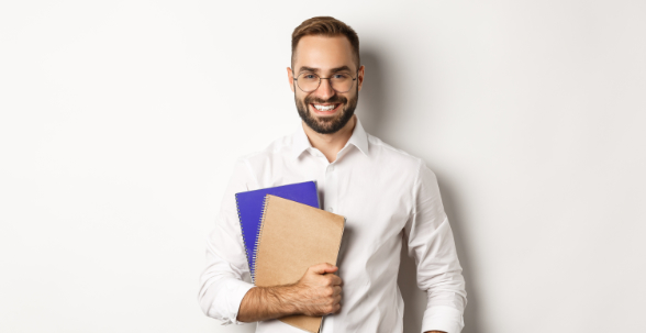 Young handsome man holding notebooks, concept of e-learning and courses